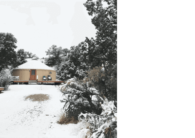 Escalante Yurts luxury yurt home page in winter covered with snow