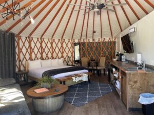 Yurt glamping gives you a sturdy, comfortable camping structure